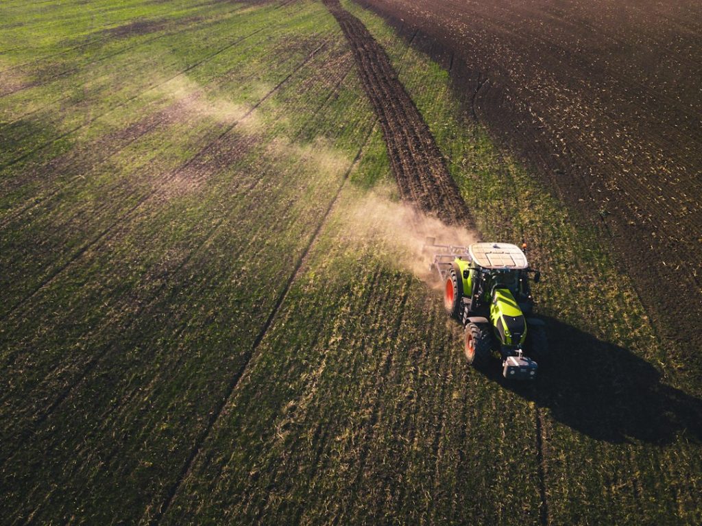 Agricultural field with farm equipment